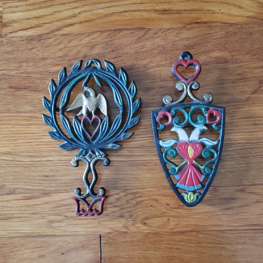 Two cast iron trivets